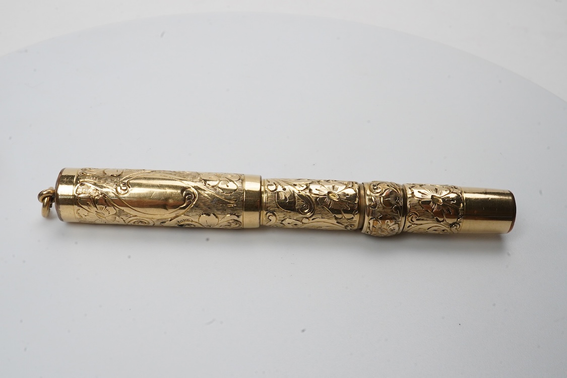 A Conklin ring top hand engraved crescent filler fountain pen with 14ct. gold Conklin nib